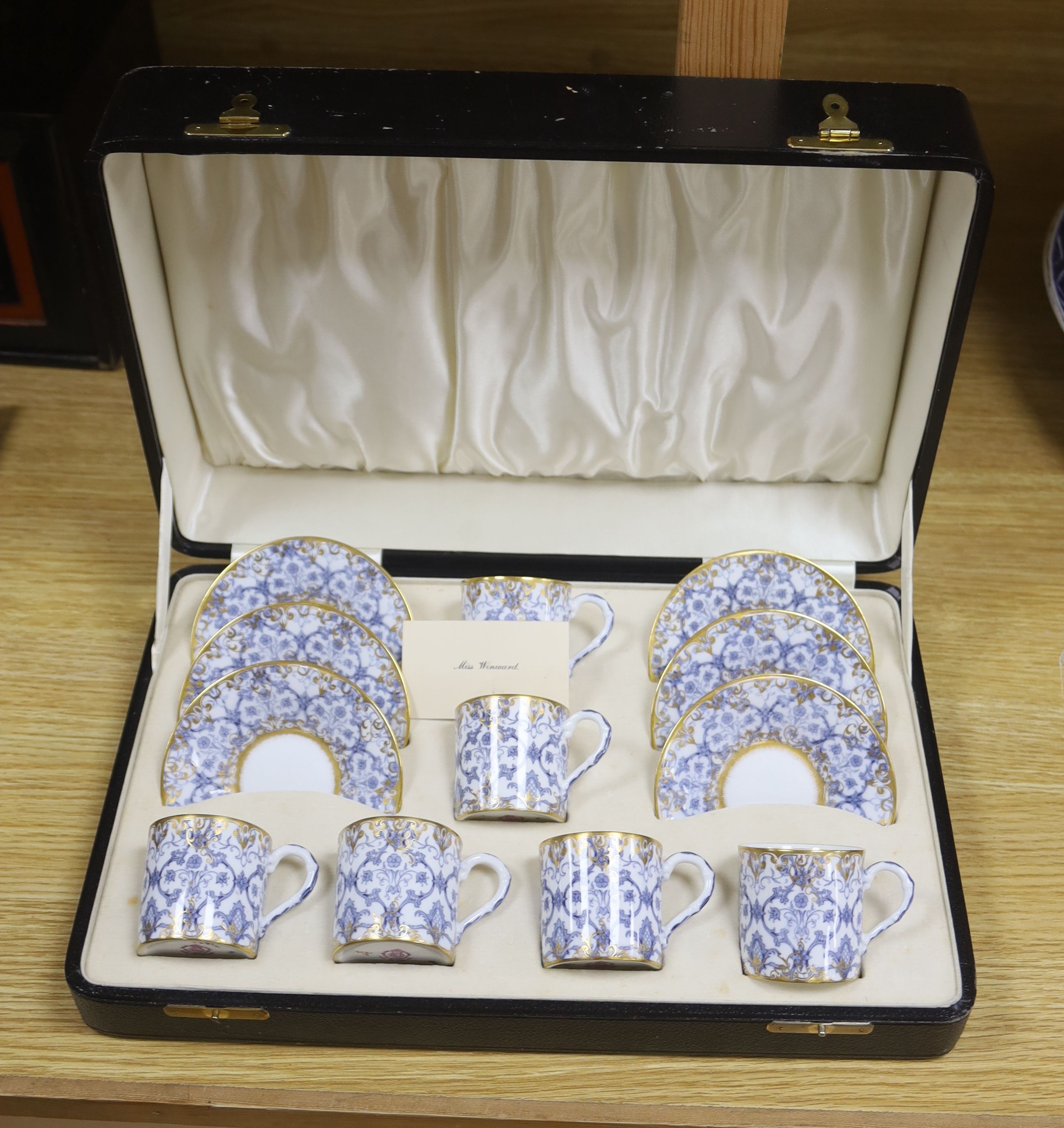 A cased Royal Worcester blue and gilt coffee for 6